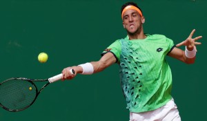 Bosnia and Herzegovina's Damir Dzumhur hits a return to Czech's Tomas Berdych during their Monte-Carlo ATP Masters Series Tournament tennis match, on April 13, 2016 in Monaco. AFP PHOTO / JEAN CHRISTOPHE MAGNENET / AFP / JEAN CHRISTOPHE MAGNENET        (Photo credit should read JEAN CHRISTOPHE MAGNENET/AFP/Getty Images)
