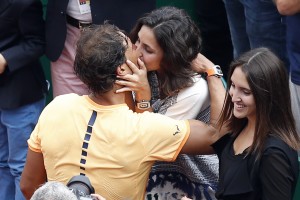Spain's Rafael Nadal kisses his girlfriend Xisca Perello after winning against France's Gael Monfils in the final tennis match at the Monte-Carlo ATP Masters Series Tournament in Monaco on April 17, 2016. Nadal defeated Monfils 7-5, 5-7, 6-0 to win a record ninth title at the Monte Carlo Masters. AFP PHOTO / VALERY HACHE / AFP / VALERY HACHE (Photo credit should read VALERY HACHE/AFP/Getty Images)